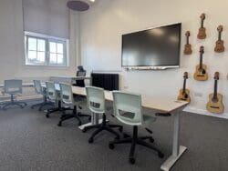 Modern school refurbishment with height adjustable desks.