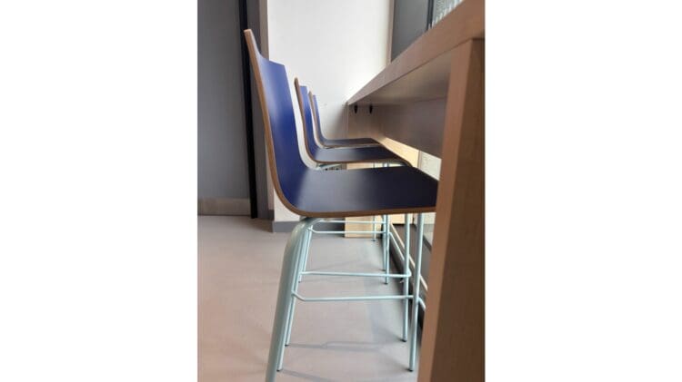 Breakout area dining stools and breakfast bar in office interior design project.