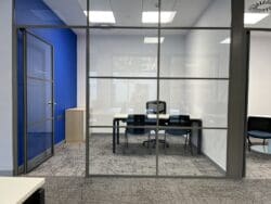 Corporate office design with branded colours and modern office furniture solutions.