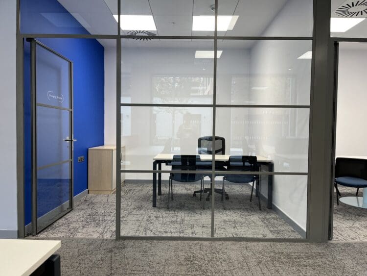 Corporate office design with branded colours and modern office furniture solutions.