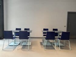 Dining furniture for office breakout space in company branded colours.