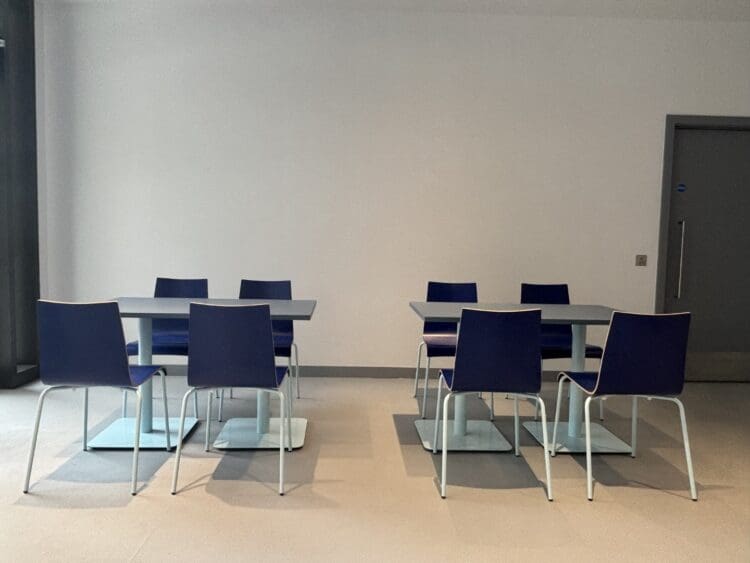 Dining furniture for office breakout space in company branded colours.