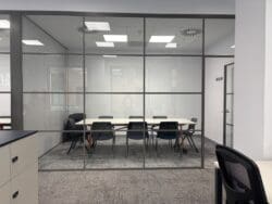 Glazed fronted meeting room in London office fit out.
