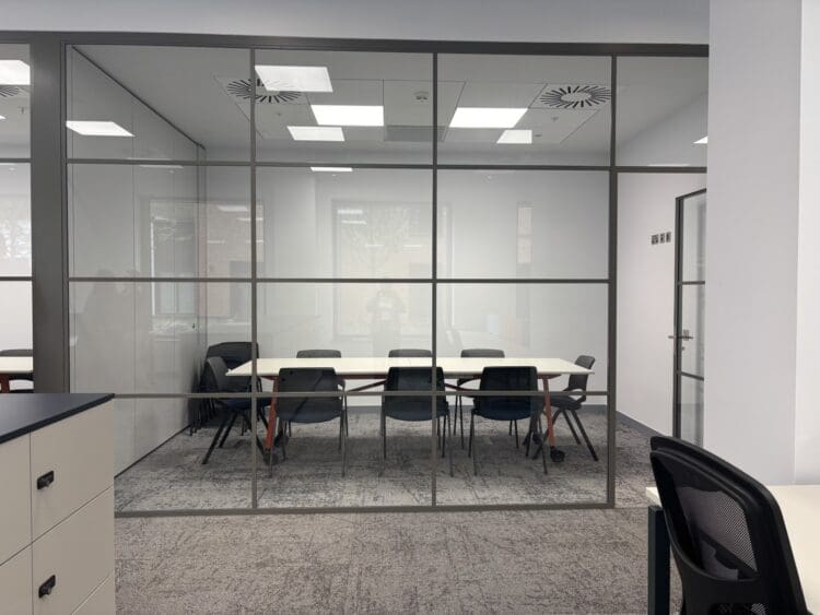 Glazed fronted meeting room in London office fit out.