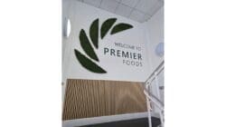 Office interior design with branded moss feature wall.