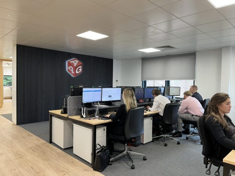 Branded office feature wall design with logo signage.