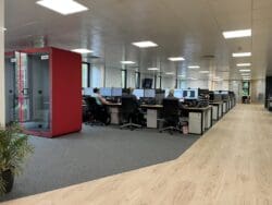 Modern office design with acoustic meeting pods.