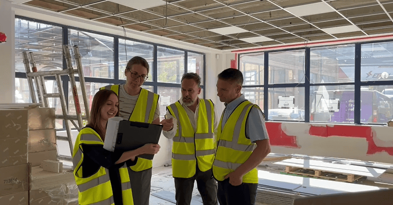 Martyn Pilcher in client meeting on site at office fit out project.