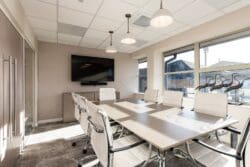 Modern office boardroom with feature lighting.