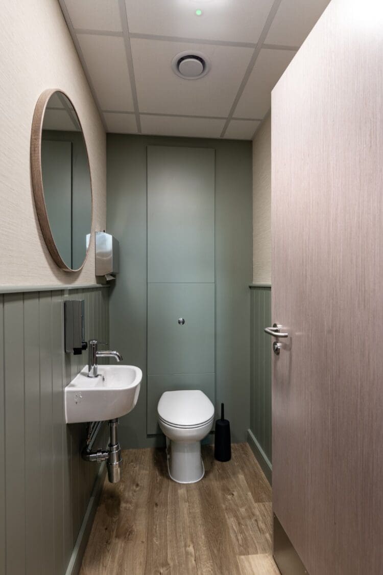 Modern office washroom fit out with wall panelling.