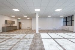 Office fit out for tennant leasing with neutral flooring.